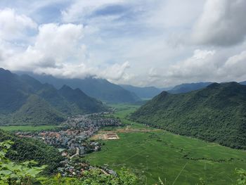 Scenic view of agricultural landscape against sky