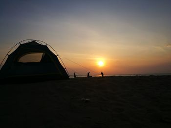 View of beach at sunset