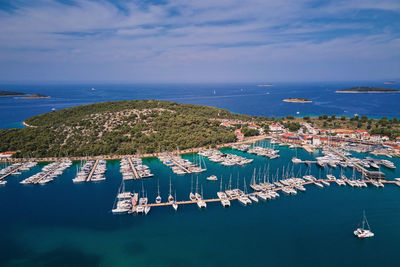 Aerial view of harbor in touristic city and moored yachts