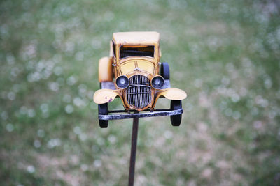 Close-up of toy car decor in back yard