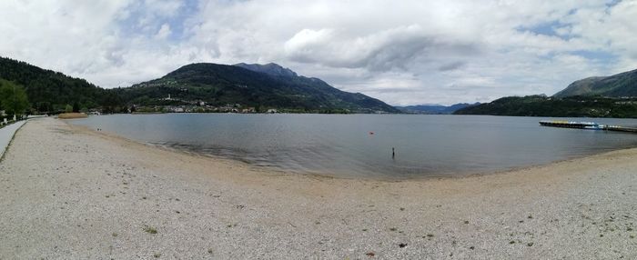 Panoramic view of bay against sky