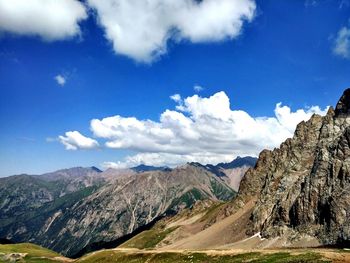 Scenic view of mountains against cloudy sky
