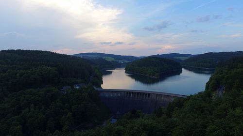 High angle view of dam by river against sky