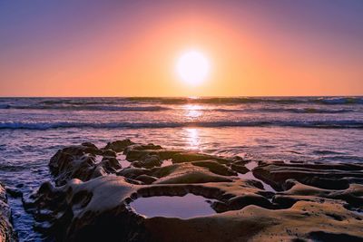 Scenic view of sea against sky during sunset