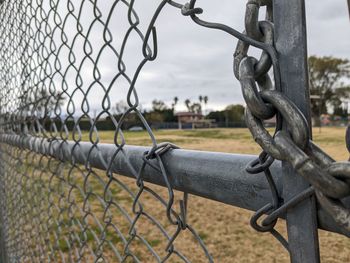 Close-up of chain on chainlink fence