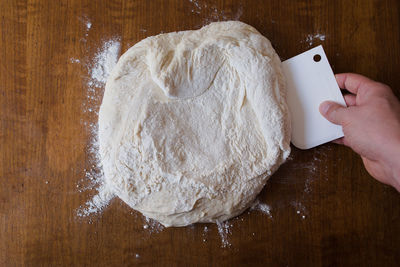 Close-up of person preparing food on table