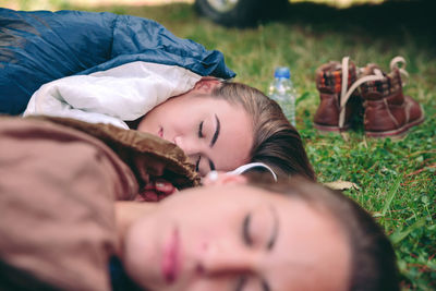 High angle view of woman sleeping on bed