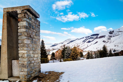 Buildings against sky during winter