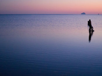 Scenic view of sea against sky at sunset