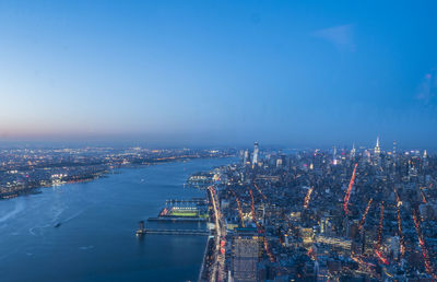 High angle view of illuminated buildings in city