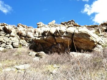 Rock formation on land against sky