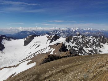 Scenic view of snowcapped mountains against sky