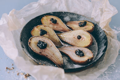 Close-up of baked pear on plate