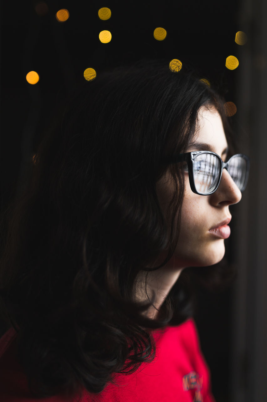 headshot, one person, portrait, lifestyles, leisure activity, real people, child, childhood, looking, women, indoors, close-up, looking away, focus on foreground, front view, young adult, innocence, hairstyle, contemplation, human face