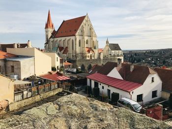 Houses in town against sky