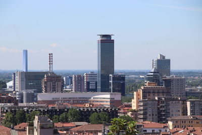 Buildings in city against sky