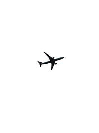 Low angle view of silhouette airplane against clear sky