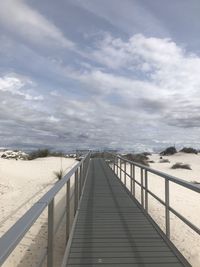 View of empty footpath during winter