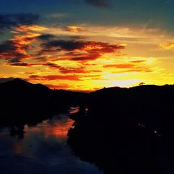 Scenic view of lake at sunset