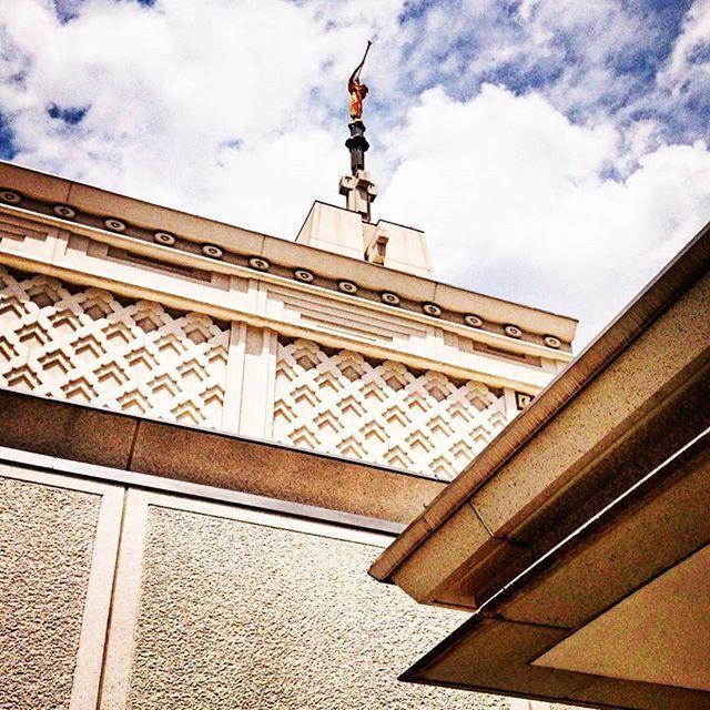 architecture, built structure, low angle view, building exterior, sky, cloud - sky, cloud, cloudy, art and craft, day, sculpture, railing, travel destinations, no people, art, outdoors, city, famous place, religion, place of worship