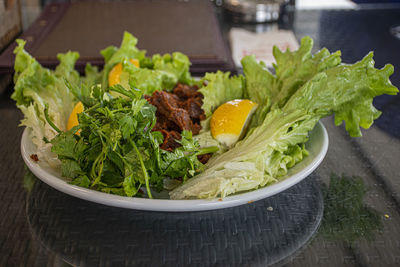 High angle view of chopped vegetables in bowl on table