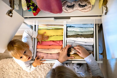 High angle view of people in bedroom