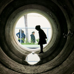 Full length of a man standing in tunnel