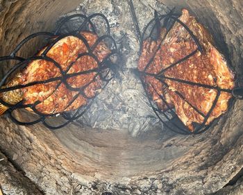 High angle view of meat on barbecue grill