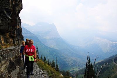 Rear view of man hiking on mountain