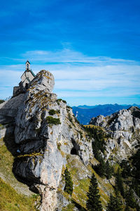 Low angle view of rock formation against sky