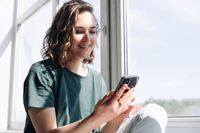 Young woman using mobile phone