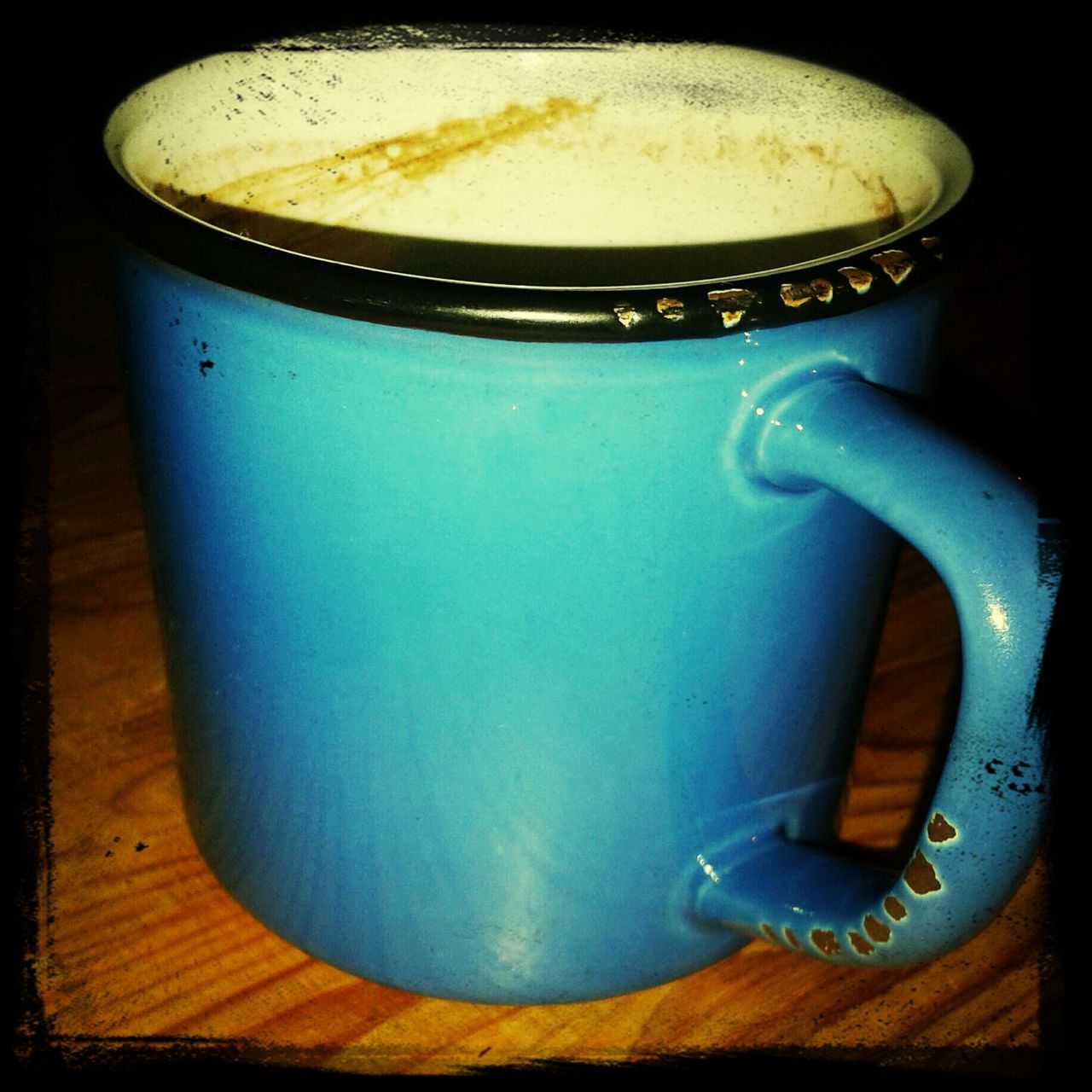 indoors, table, still life, drink, close-up, coffee cup, refreshment, food and drink, coffee - drink, high angle view, single object, cup, no people, frothy drink, coffee, saucer, wood - material, cappuccino, handle, focus on foreground