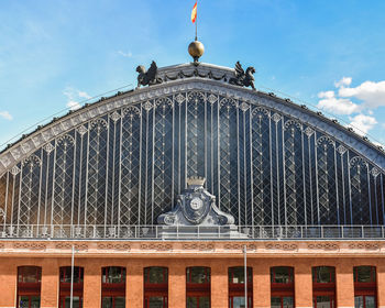 Facade atocha train station in a sunny day madrid, spain