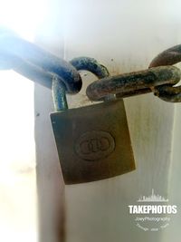 Close-up of padlocks on metal chain