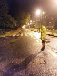 People walking on street at night