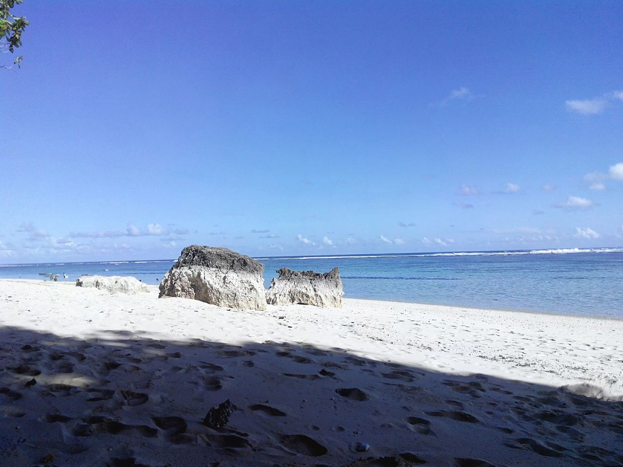 beach, sea, horizon over water, sand, water, shore, sky, tranquil scene, tranquility, scenics, blue, beauty in nature, nature, coastline, vacations, idyllic, incidental people, day, remote, non-urban scene