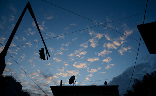 Low angle view of cables against sky