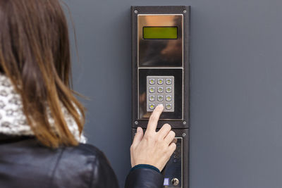 Close-up of woman holding mobile phone