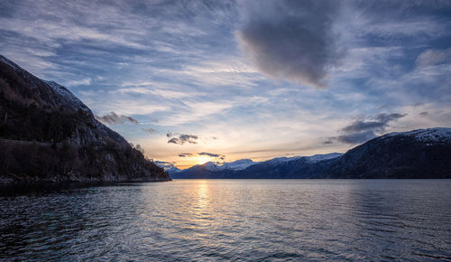 Scenic view of lake against sky during sunset