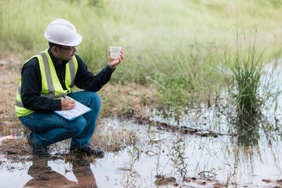 Marine biologist analysing water test results and algea samples