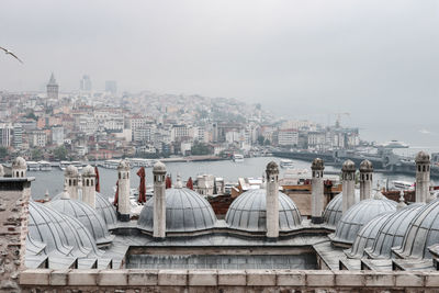 Buildings in city against sky