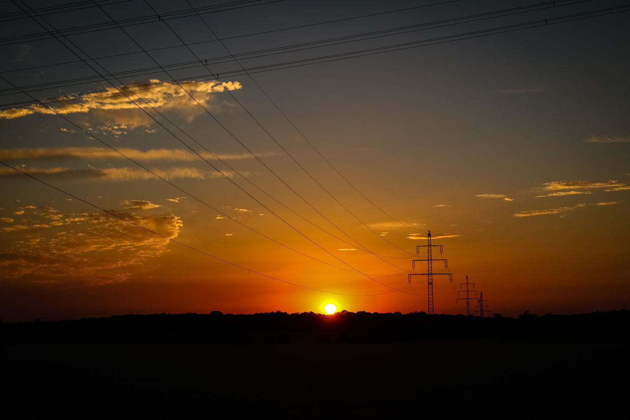 SILHOUETTE ELECTRICITY PYLON DURING SUNSET AGAINST SKY