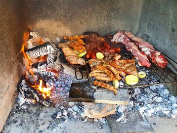 High angle view of meat on barbecue grill