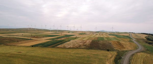 Scenic view of farm against sky