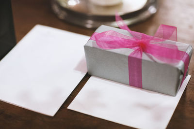 High angle view of paper in box on table