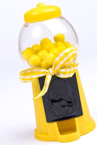 High angle view of yellow juice against white background