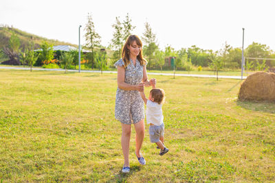 Full length of a woman standing on grass