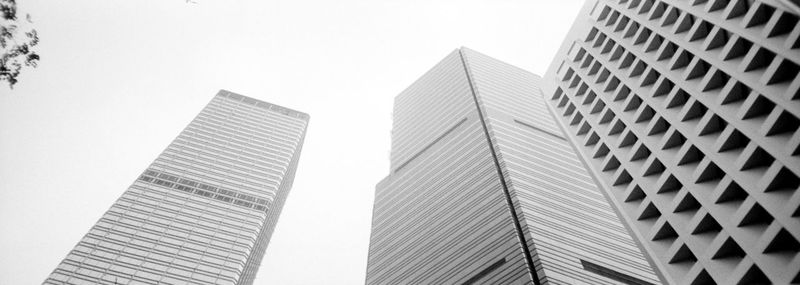 Low angle view of modern buildings against clear sky