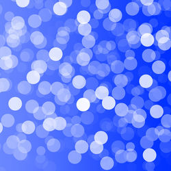 Defocused image of illuminated blue lights