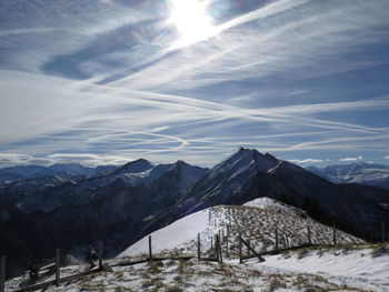 Scenic view of snowcapped mountains against sky